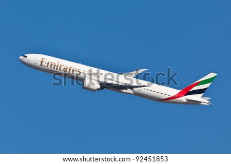 NEW YORK - JUNE 10: Boeing 777 Emirates climbs after take off from JFK airport located in New York, June 10, 2011. Emirates is rated as a top10 best airline in the world flying on youngest fleet