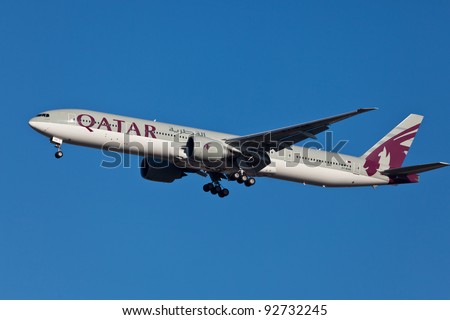 NEW YORK - JANUARY 5: Boeing 777 Qatar on final approach to JFK in New York, USA on JANUARY 5, 2012 Qatar Airline is rated 3rd best airlines in the world Qatar airline is flag carrier airline of Qatar