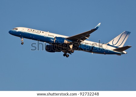 NEW YORK - JANUARY 11: A Boeing 757 United approaches JFK in New York, USA on January 11, 2012 United merged with Continental in 2011 and famous blue painting scheme of the planes is no longer in use