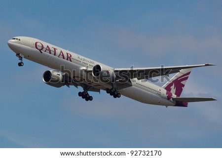 NEW YORK - JANUARY 5: Boeing 777 Qatar on final approach to JFK in New York, USA on JANUARY 5, 2012 Qatar Airline is rated 3rd best airlines in the world Qatar airline is flag carrier airline of Qatar