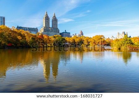 NEW YORK - NOVEMBER 4: Fall foliage in Central Park with Manhattan buildings in background on November 4, 2013. The park is located in the center of Manhattan and is one of the biggest parks in USA.