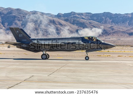 LAS VEGAS -NOVEMBER 8: F-35 fighter taxis on runway during Aviation Nation airshow at Nellis AFB on November 8,2014 in Las Vegas,NV. It is the world\'s most advanced multi-role fighter.