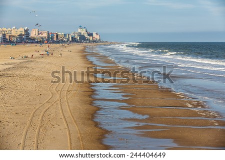 OCEAN CITY - MAY 24: View of the seashore with beachfront hotels in the background in Ocean City, MD on May 24, 2014. Ocean City, MD is a popular beach resorts on the East Coast.