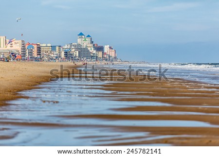 OCEAN CITY - SEPTEMBER 9: View of the seashore with beachfront hotels in the background in Ocean City, MD on September 9, 2014. Ocean City, MD is a popular beach resorts on the East Coast.
