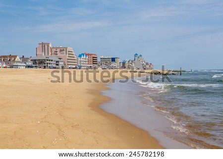 OCEAN CITY - MAY 24: View of the seashore with beachfront hotels in the background in Ocean City, MD on May 24, 2014. Ocean City, MD is a popular beach resorts on the East Coast.