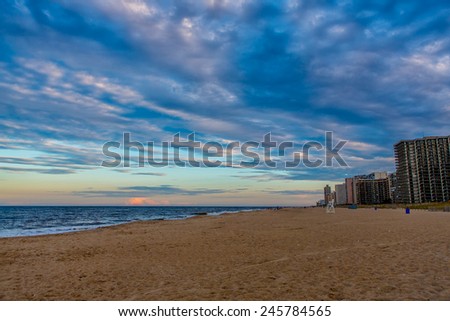 OCEAN CITY - SEPTEMBER 6: View of the seashore with beachfront hotels in the background in Ocean City, MD on September 6, 2014. Ocean City, MD is a popular beach resort on the East Coast.