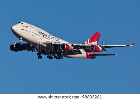 NEW YORK - MARCH 2: Boeing 747 Virgin Atlantic approaches JFK Airport in New York on March 2, 2012 Plane is wearing new livery announced in early 2011 Boeing 747 is popularly called Jumbo Jet