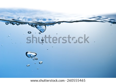 blue water wave and air bubbles