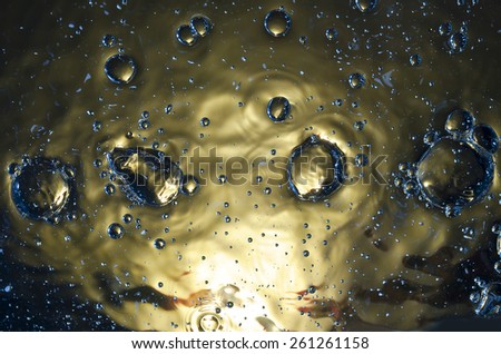 colored bubbles in the dark water