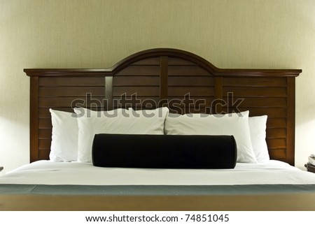 Comfortable bed settings with fluffy pillows and fresh linens