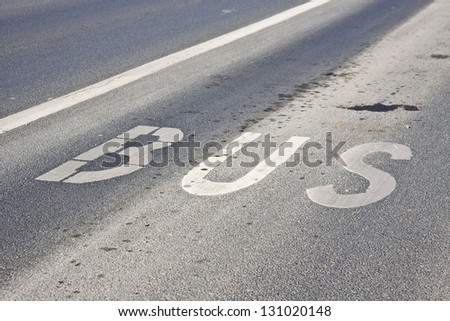 Road markings on tarmac for city bus lane