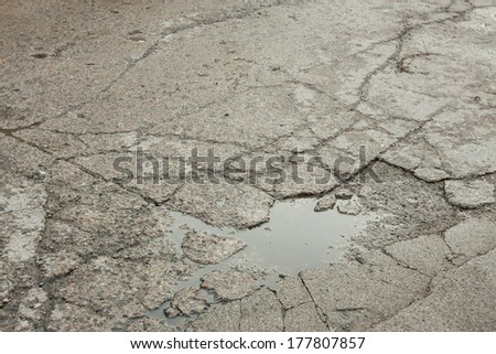 A hole in the asphalt road