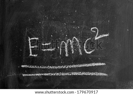 Blackboard writing on it with chalk - with the model emc2