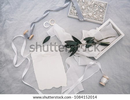 Wedding invitation card with decorations on linen background. Rustic Wedding  Overhead view. Flat lay, top view wedding invitation card Templates
