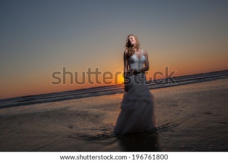 Happy bride  on a beautiful beach. Happy bride  on a beautiful beach. Beautiful bride by the sea