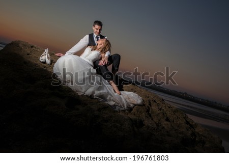 Happy bride and groom on a beautiful beach. Wedding Couple, Happy romantic bride and groom in love