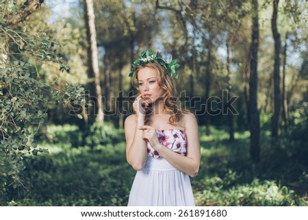 Photo of romantic woman in fairy forest.