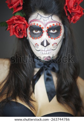 attractive young woman with sugar skull makeup