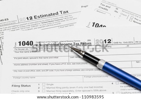 Tax form 1040 for tax year 2012 for US individual tax return with pen