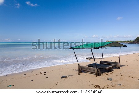 Sand swamps and buries table and chairs at bar on Friar\'s beach St Martin Sint Maarten