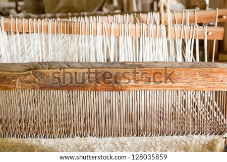 Old weaving loom made from timber making cloth in La Purisima mission California