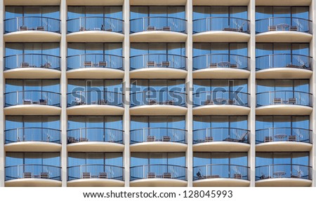 Pattern of hotel room balconies in modern building with all door closed and regular