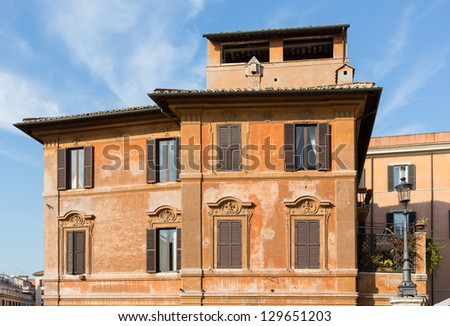 Side view of old roman house by Spanish steps in Rome housing restaurant