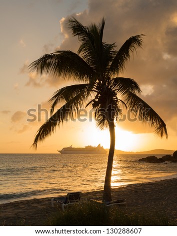 Cruise ship leaves Charlotte Amalie at sunset past Frenchmans bay on St Thomas USVI