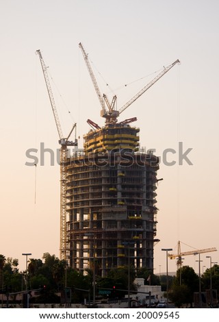 Framework of new office building in Abu Dhabi in UAE with cranes and construction