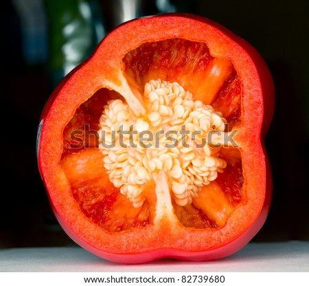 Interior of sliced red pepper in macro shot showing seeds and details of the inside of the vegetable