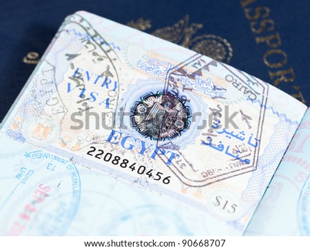 Macro image of visa and immigration stamps in US passport for Cairo Egypt