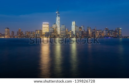 Skyline of lower Manhattan of New York City from Exchange Place at night with World Trade Center at full height of 1776 feet May 2013