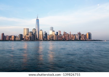 Skyline of lower Manhattan of New York City from Exchange Place at dusk with World Trade Center at full height of 1776 feet May 2013