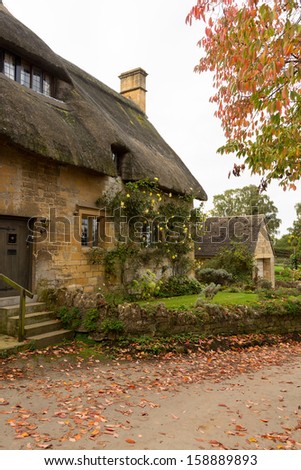 Thatched cottage in Stanton in Cotswold or Cotswolds district of southern England in the autumn.