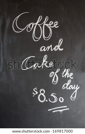 Coffee and cake of the day blackboard in cafe, coffee shop or restaurant