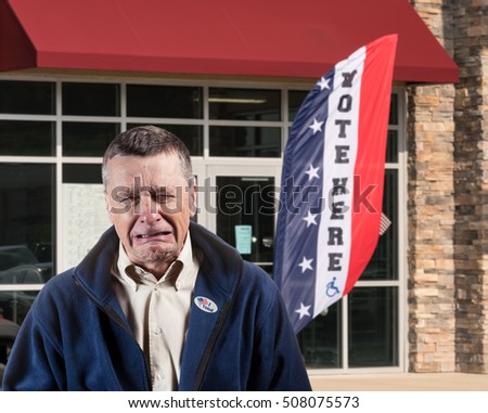 Depressed and weeping voter outside  an early voting ballot location for the 2016 USA Presidential election after making his choice