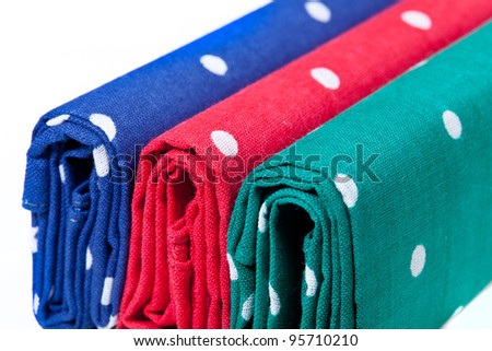Folder linen handkerchiefs in red blue and green with white spots