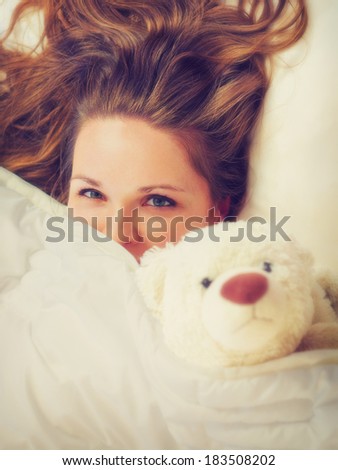 The Waggish girl / Vintage style photo from a young women in the bed