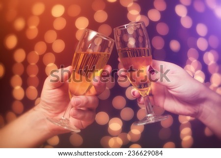 New year toast / two people make a toast with a champagne for a happy new year