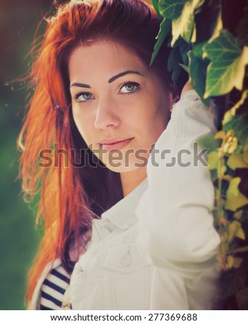 Attractive women, close up photo with custom white balance color filters, and some fine film grain added