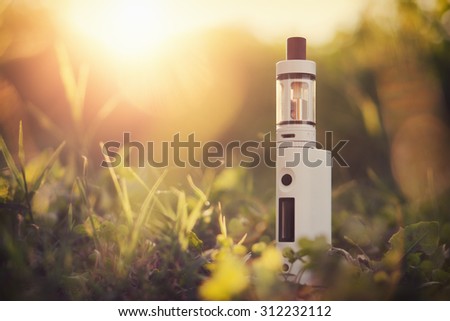 Adjustable electronic cigarette, Non carcinogenic alternative for smoking, sunset in the background, with custom white balance and color filters