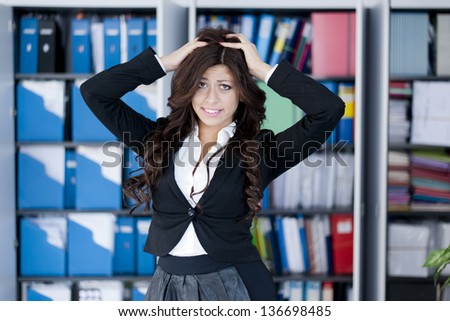 young funny business woman posing on office background