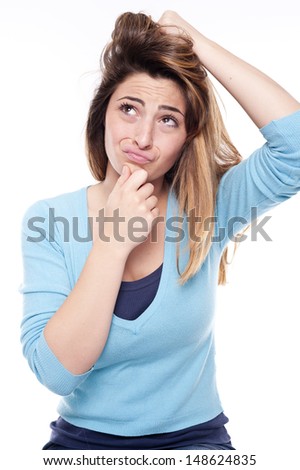 Young worried cute woman on white background