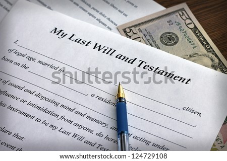 Last Will and Testament form with pen, close-up
