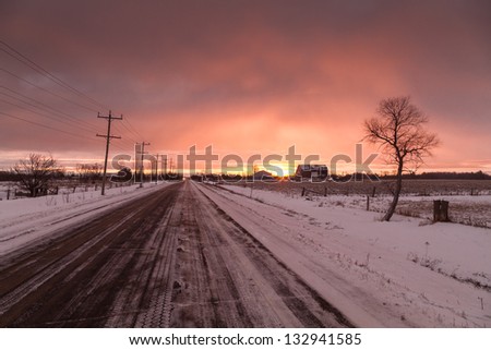 Early winter morning road in northern Ontario countryside