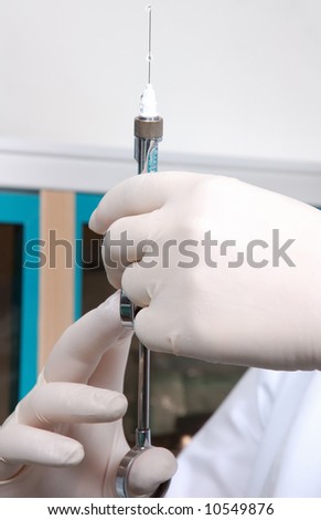 two hands make injection shot