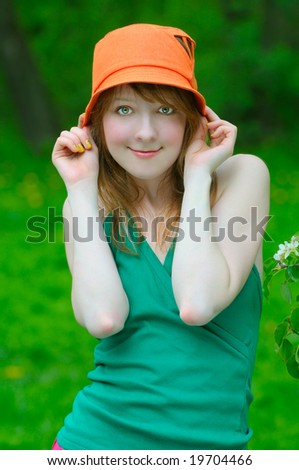 pretty girl hold orange bonnet