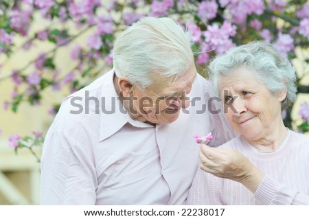 happy couple old people on spring background