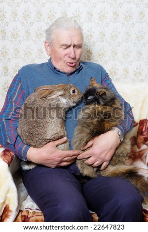 elderly man with bunny and cat