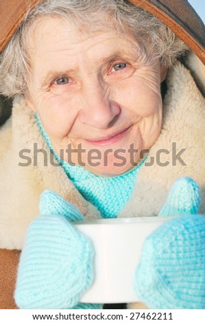 smiling elderly woman with mug